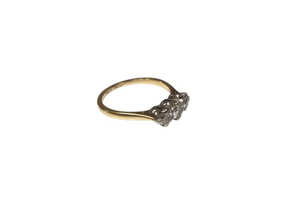 Lot 141 - Diamond three stone ring with three round brilliant cut diamonds in platinum claw setting on 18ct gold shank