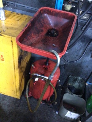 Lot 62 - Portable oil draining system with red bottle