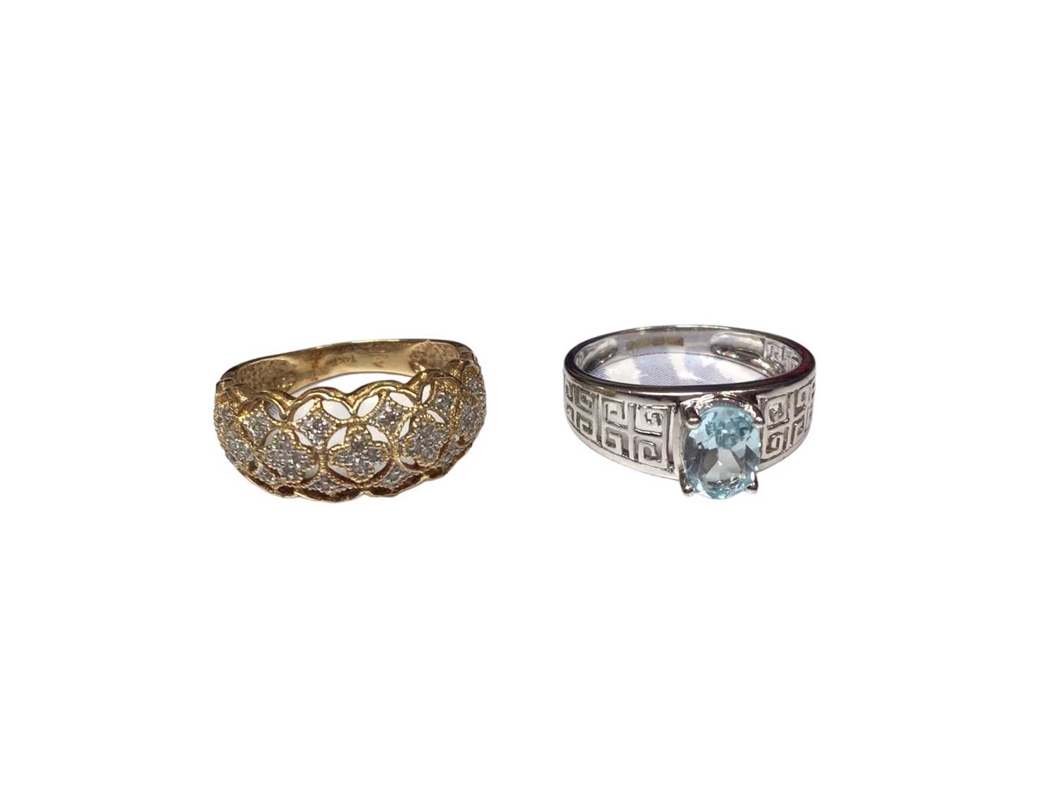 Lot 178 - 14ct gold dress ring with a diamond set pierced design and a 9ct white gold blue stone dress ring with pierced Greek key design