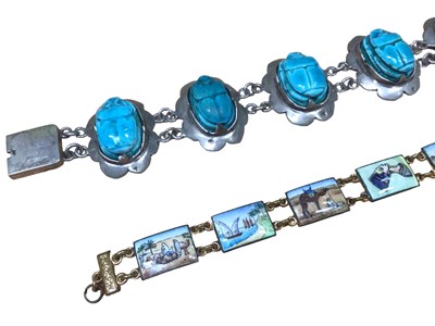 Lot 40 - Egyptian white metal and glazed turquoise scarab beetle bracelet, together with an Egyptian enamelled panel bracelet (2)