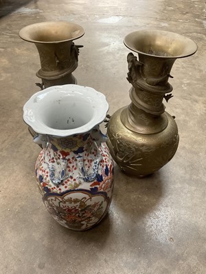 Lot 144 - Pair of Oriental brass vases and a Japanese porcelain vase
