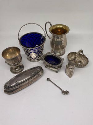 Lot 1117 - Group of silver including blue glass lined basket, silver egg cup, unmarked cup, cruets etc.