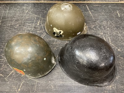 Lot 161 - Three military helmets