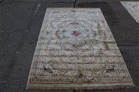 Lot 1436 - French-style rug with cream ground and central...