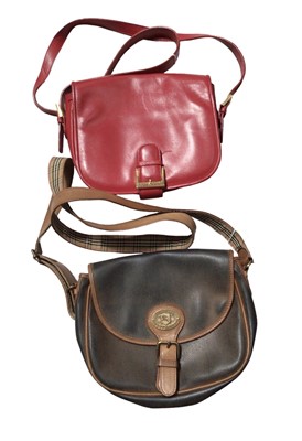 Lot 2135 - Burberrys’  vintage satchel style handbag, textured black with tan leather plus a red leather Burberrys handbag.