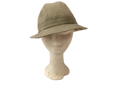Lot 2136 - Burberrys’ women's hats, two felt trilby style, navy canvas bucket hat and a green canvas hat with feather.