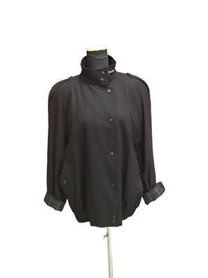 Lot 2141 - Burberrys’ women's wool jacket with tartan lining and turn back cuffs. Size 14.