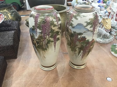 Lot 505 - Pair of Japanese Satsuma vases, circa 1900, marked to bases, painted with wisterias