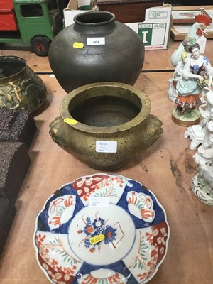 Lot 504 - Large Chinese brass censer with mask handles, together with a Japanese pottery vase and an Imari plate (3)