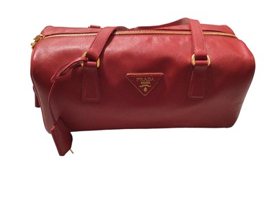 Lot 2127 - Prada saffiano red leather Bowling bag with padlock and key.  Dimensions W.28cm, H. 15cm (not including handles), D. 13cm, all approximate.