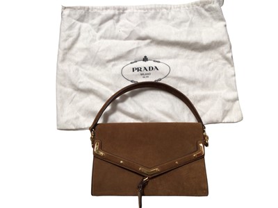 Lot 2128 - Prada light brown suede envelope front handbag with luggage tag and soft Prada dust bag. Dimensions W. 24cm, H. 16cm, D 5cm (when closed), all approximate.