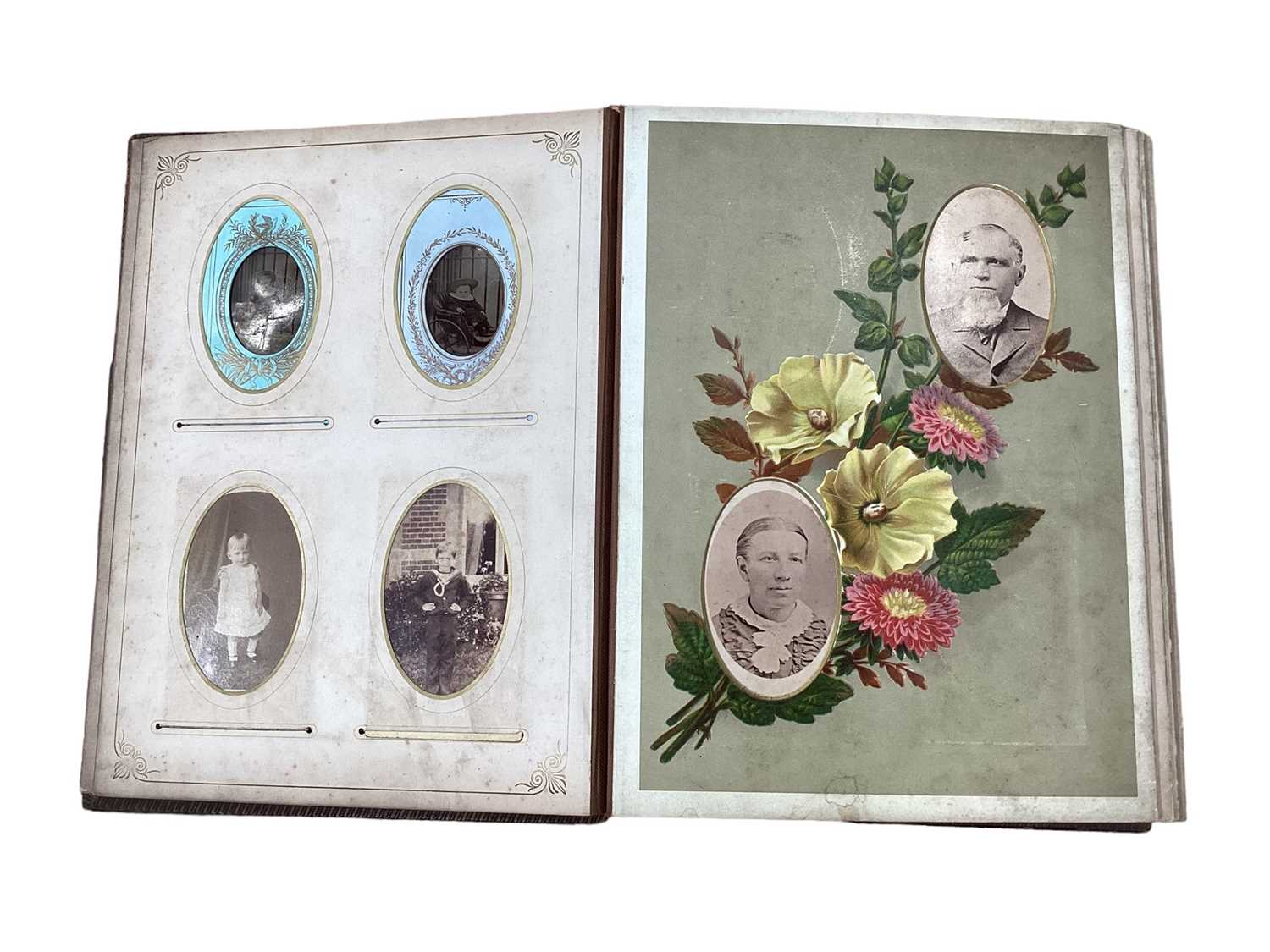 Lot 1598 - Two Victorian leather photograph albums containing various CDV and Cabinet card photographs including an amusing photograph of a man holding an African Grey Parrot.