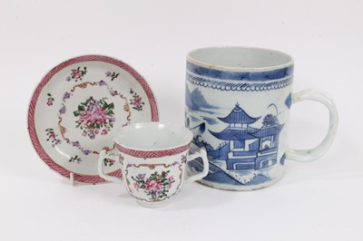 Lot 318 - A Chinese famille rose chocolate cup and saucer, Qianlong and a Chinese export blue and white cylindrical mug