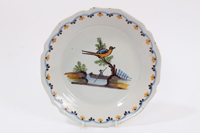 Lot 80 - French faience plate, painted with a bird and a man in a boat, circa 1820