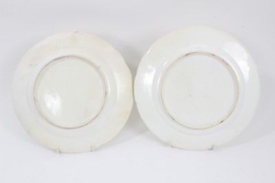 Lot 85 - Pair of Coalport plates, painted with flowers, on a bright green ground, circa 1820