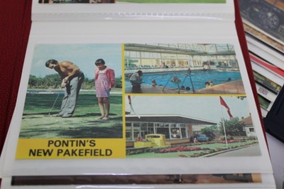 Lot 1442 - Postcards in albums, mixed periods, most themes including street scenes, GB and Foreign holidays, greetings, children's cards etc. In two boxes.
