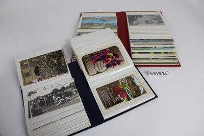 Lot 1444 - Postcards in five albums including real photographic Nen Parade, VAD hospital, crowd scene all Wisbech, zeppelin wreck East Anglia 1917,other street scenes, exhibitions, greetings, children's cards...