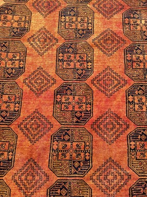 Lot 1515 - Eastern rug on orange and blue ground