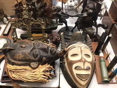 Lot 431 - Two African carved wood masks, two wooden model ships, figure brass photograph frame, set of scales, two glazed frames containing butterflies, figure ornaments and sundries