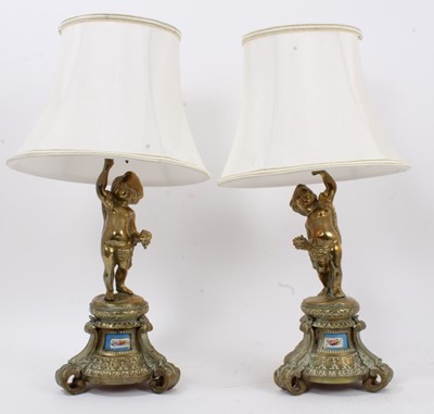 Lot 973 - Pair of bronze figures table lamps inset with porcelain panels