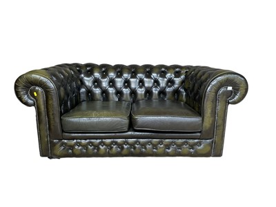 Lot 28 - Green leather two-seater chesterfield settee