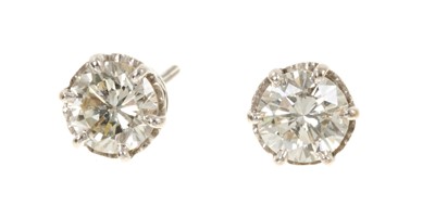 Lot 690 - Pair of diamond single stone stud earrings