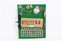 Lot 581 - One board mounted with Coinss, cap badges,...
