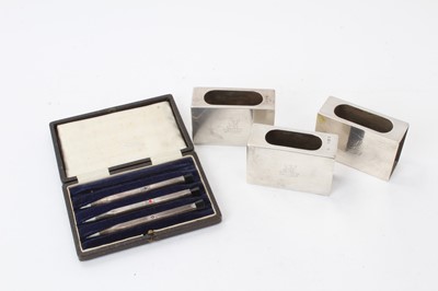 Lot 470 - Three silver matchbox covers and a set of three silver bridge pencils in fitted case