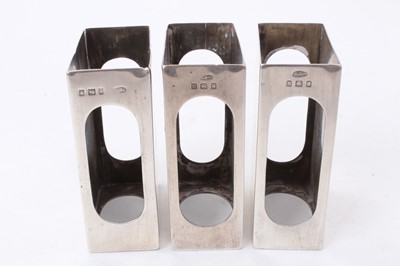 Lot 470 - Three silver matchbox covers and a set of three silver bridge pencils in fitted case