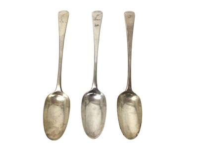 Lot 471 - Three George III silver old English pattern table spoons