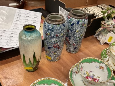 Lot 719 - Pair of silver mounted pottery spill vases, together with an enamel vase (a/f)