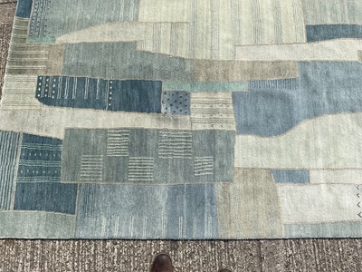 Lot 1480 - Large contemporary rug with abstract design on blue ground, approximately 235cm x 170cm