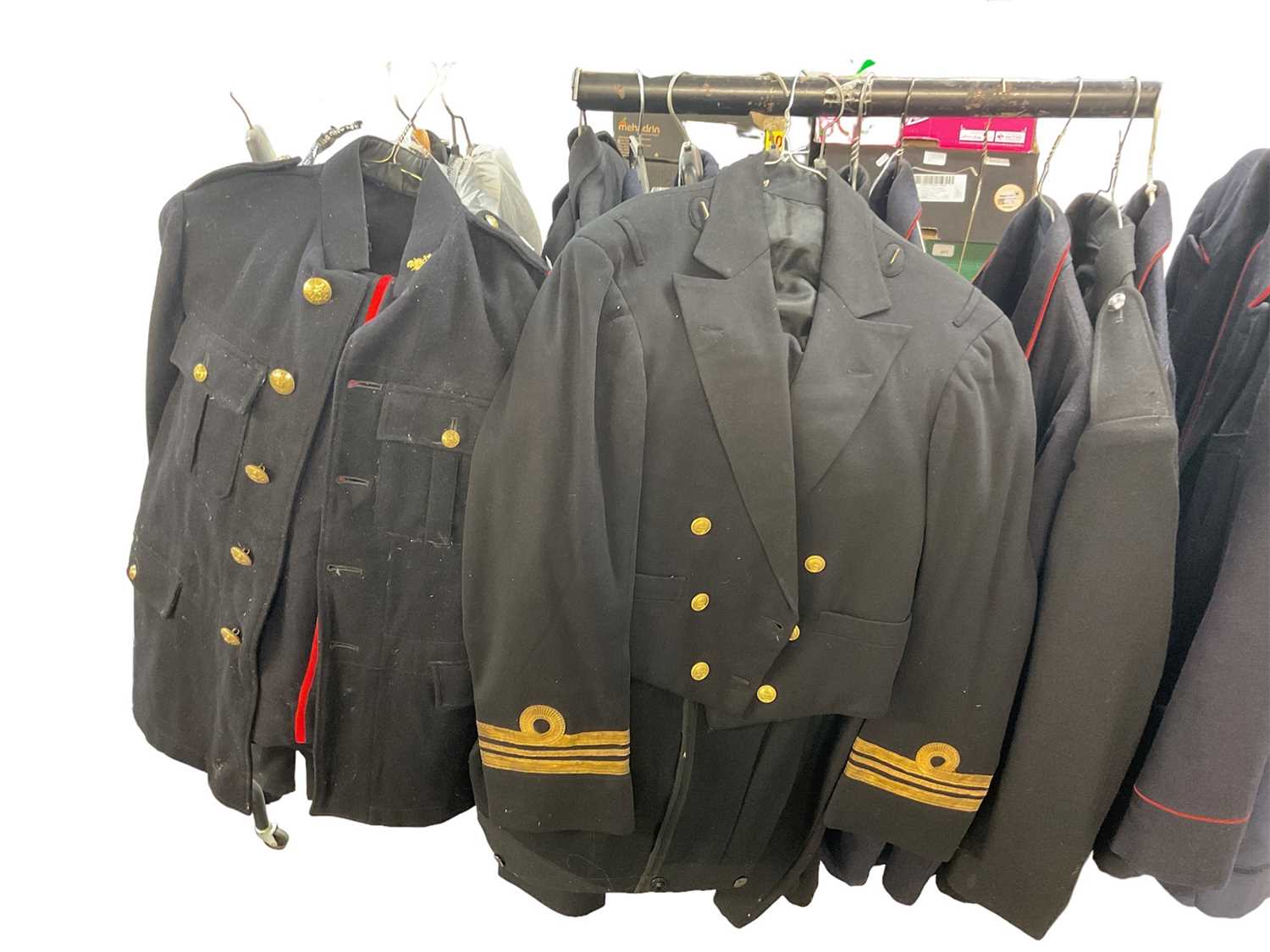 Lot 783 - Collection of various post Second World War military uniform together with Police and Fire Brigade jackets. (1 rail)