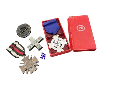 Lot 766 - Nazi German National Service 25 years Long Service award in box of issue, wound badge and other German awards. (4)