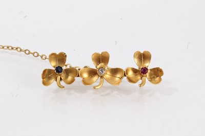 Lot 662 - Edwardian gold diamond, ruby, and sapphire triple clover-leaf brooch