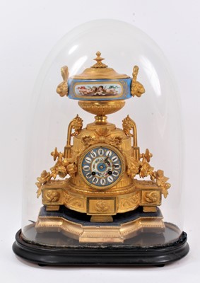 Lot 1092 - 19th century French porcelain and gilt mounted mantel clock under a glass dome.