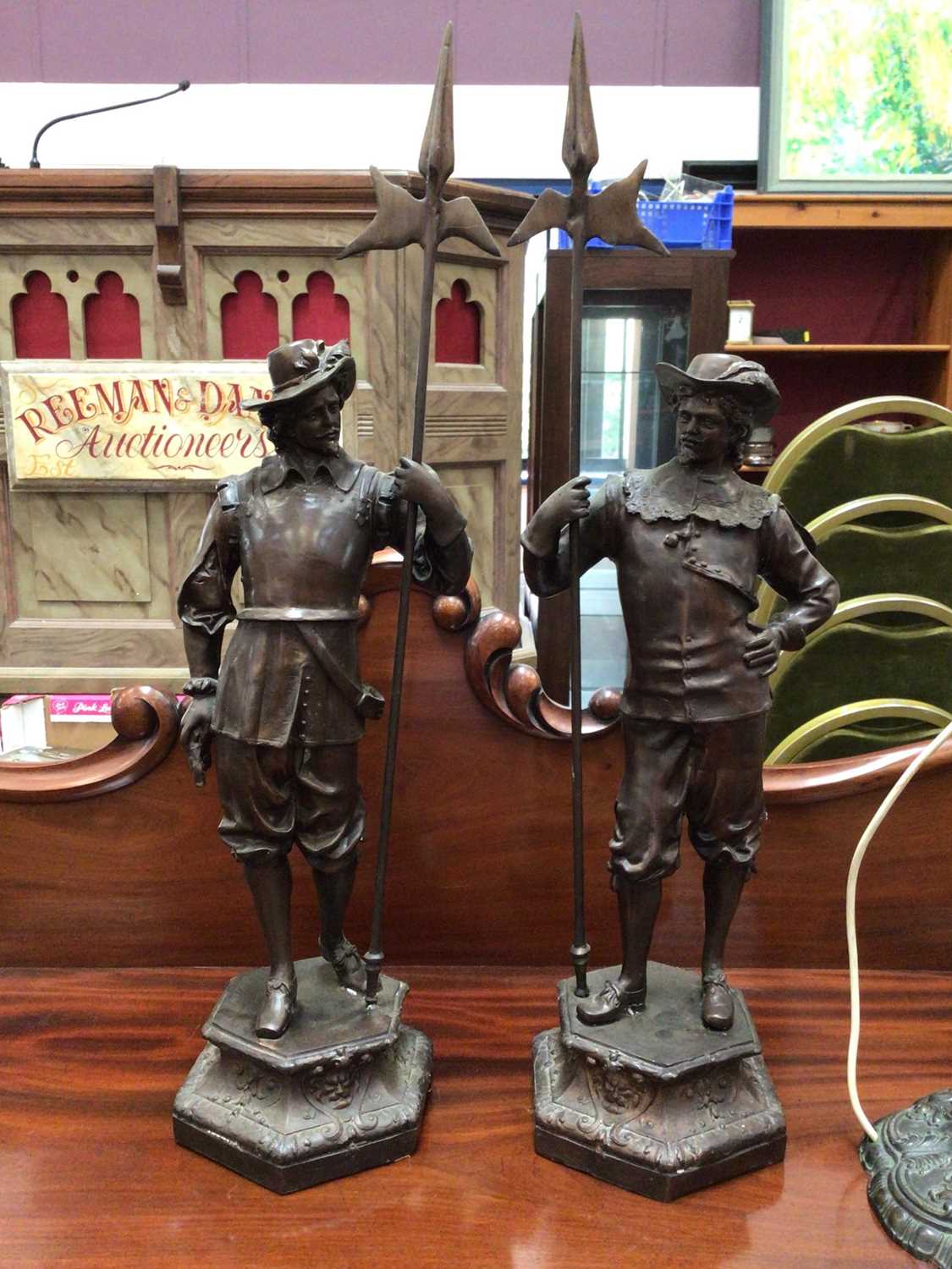 Lot 38 - A pair of bronzed figures of cavaliers, signed Winslow, 68cm high