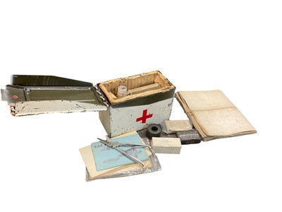 Lot 779 - Military ammunition box painted as a first aid tin and filled with contents, together with various maps and booklets.