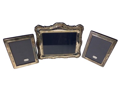 Lot 106 - Pair of silver photograph frames and one other Mappin & Webb silver photograph frame with engraved presentation inscription, all boxed