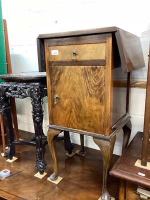 Lot 1219 - Walnut drop flap bedside cabinet with single drawer and cupboard below on cabriole legs together with a folding two tier table (2)