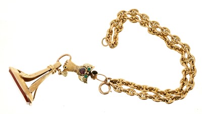 Lot 649 - Regency gold and gem-set clasp in the form of a gloved hand grasping a snake, suspending a Georgian gold seal on an antique gold mariner-link double strand bracelet.