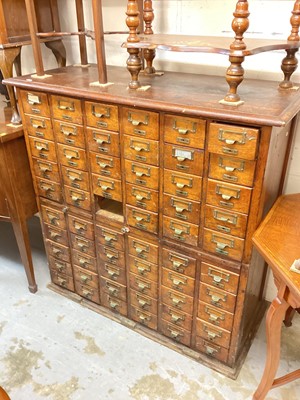 Lot 1221 - Early 20th century oak bank of drawers with brass handles (one drawer missing) 107cm wide, 50cm deep, 107cm high