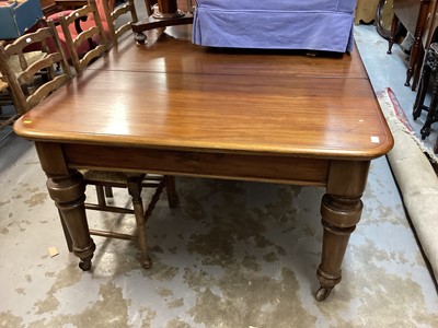 Lot 1225 - Victorian mahogany extending dining table with two extra leaves on turned legs and castors, opening to 225cm x 130cm