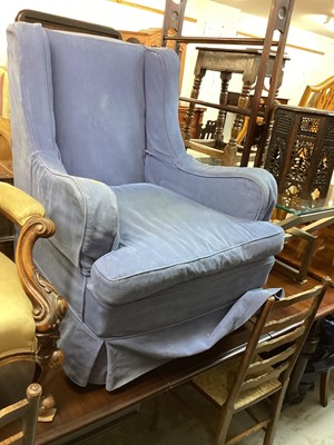 Lot 1226 - Edwardian wing back armchair with loose blue cover on square taper front legs and castors