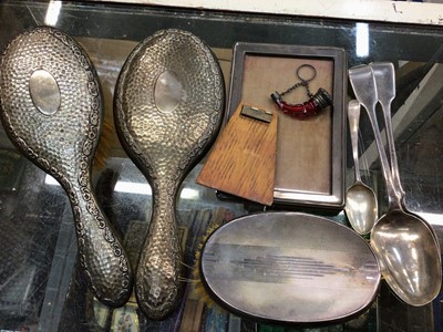 Lot 1057 - Group of silver to include a pair of Georgian serving spoons, teaspoon, dressing table items, photograph frame and a ruby glass perfume bottle