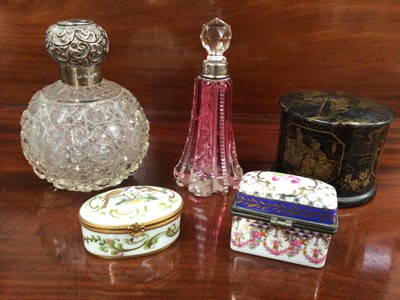 Lot 113 - Silver topped cut cranberry glass scent bottle, another silver topped globular cut glass scent bottle, and other objets vertu