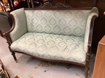 Lot 1249 - Late Victorian mahogany framed sofa with blue upholstery on turned front legs and brass castors, 128cm wide, 60cm deep, 90cm high