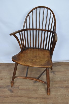 Lot 1405 - Early 19th century ash and elm hoop back Windsor chair, with solid saddle seat and crinoline stretcher