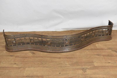 Lot 1406 - Good Georgian steel serpentine fender, with pierced and boss ornament, 145cm wide