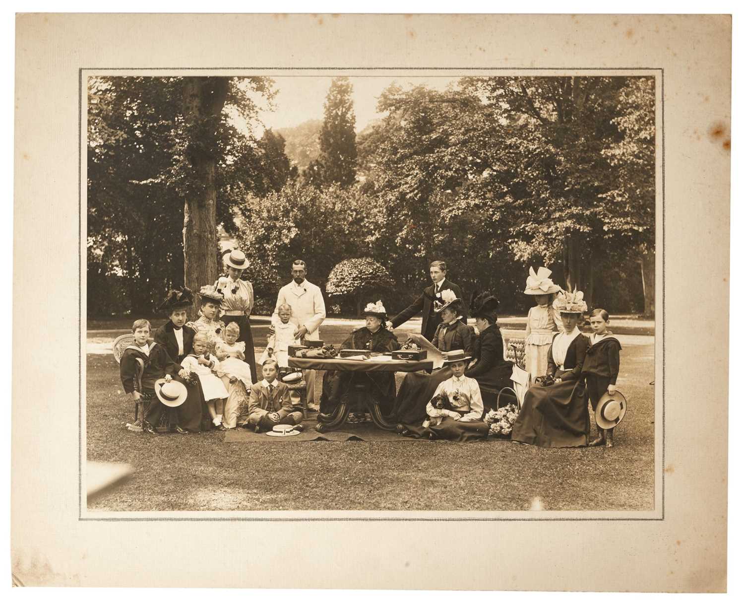 Lot 20 - H.M.Queen Victoria and family, fine silver gelatine photograph of the Queen and her family taken in the garden at Osborne in 1898 including three future Kings of England, mounted on card 24 x 30cm...